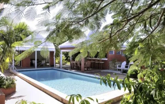 Villa des Artistes: Gingerbread-trimmed cottages and bungalows encircle pool, lush grounds, close proximity to some of the best beaches on the island.